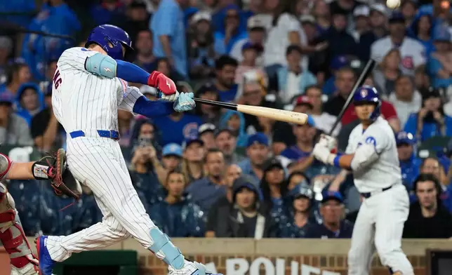 Chicago Cubs' Pete Crow-Armstrong hits a solo home run during the first inning of a baseball game against the Cincinnati Reds in Chicago, Sunday, Aug. 30, 2026. (AP Photo/Nam Y. Huh)