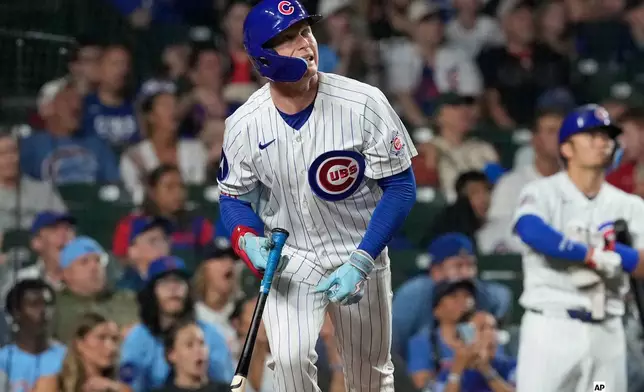 Chicago Cubs' Pete Crow-Armstrong watches his solo home run during the ninth inning of a baseball game against the Cincinnati Reds in Chicago, Sunday, Aug. 30, 2026. (AP Photo/Nam Y. Huh)