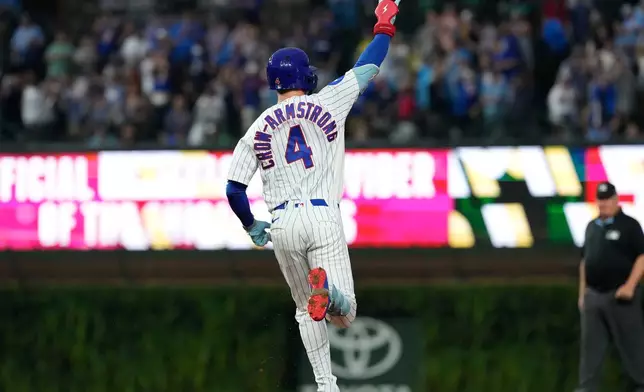 Chicago Cubs' Pete Crow-Armstrong celebrates as he rounds the bases after hitting a solo home run during the first inning of a baseball game against the Cincinnati Reds in Chicago, Sunday, Aug. 30, 2026. (AP Photo/Nam Y. Huh)