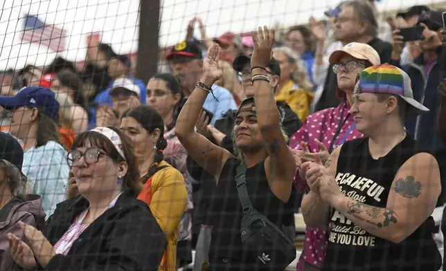 Fans cheer before the inaugural Women's Professional Baseball League game between the Los Angeles Queens and the New York Heights, Saturday, Aug. 1, 2026, in Springfield, Ill. (AP Photo/Lexie Knight)