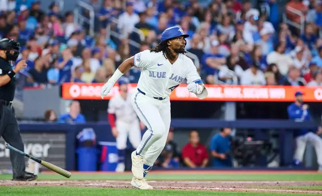 Toronto Blue Jays' Charles McAdoo rounds the bases after hitting a home run against the Boston Red Sox during the fifth inning of a baseball game in Toronto, Monday, Aug. 10, 2026. (Sammy Kogan/The Canadian Press via AP)