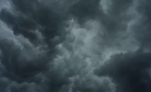 Storm clouds are seen over the Cincinnati Bengals NFL football practice in Cincinnati, Tuesday, Aug. 11, 2026. (AP Photo/Carolyn Kaster)