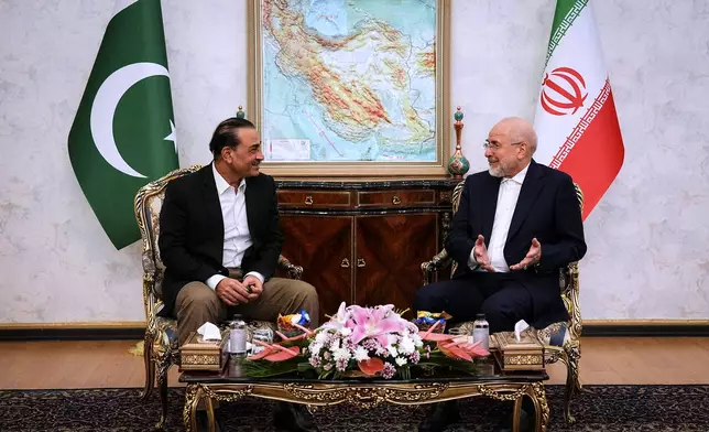 In this photo released by Islamic Consultative Assembly News Agency, ICANA, Iran's Parliament Speaker and top negotiator Mohammad Bagher Qalibaf, right, speaks with Pakistan's Army Chief Field Marshal Gen. Asim Munir during their meeting in Tehran, Iran, Monday, Aug. 24, 2026. (Mahmoud Hosseini/ICANA via AP)