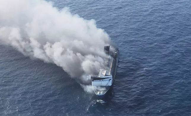 Smoke billows from passenger ship Mutiara Santosa 2 after it caught fire in the waters off Madura Island, Indonesia, Sunday, Aug. 2, 2026. (AP Photo)