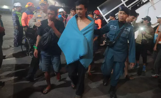 Survivors of a ferry fire arrive at Tanjung Perak Port in Surabaya, East Java, Indonesia, Monday, Aug. 3, 2026. (AP Photo/Trisnadi)