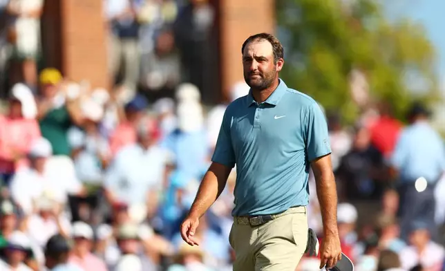 Scottie Scheffler walks off the 18th green during the final round of the PGA Tour Championship golf tournament Sunday, Aug. 30, 2026, in Atlanta. (AP Photo/Colin Hubbard)