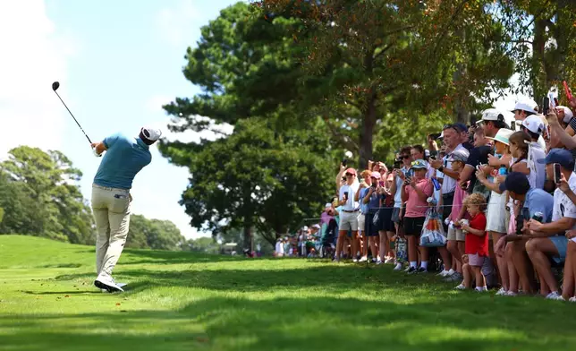 Scottie Scheffler hits from the first fairway during the final round of the PGA Tour Championship golf tournament Sunday, Aug. 30, 2026, in Atlanta. (AP Photo/Colin Hubbard)