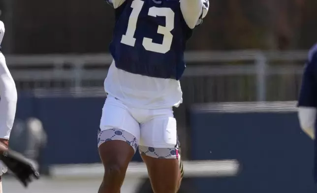 Dallas Cowboys defensive back Caleb Downs catches a pass during the NFL football team's training camp, Tuesday, Aug. 4, 2026, in Oxnard, Calif. (AP Photo/Mark J. Terrill)