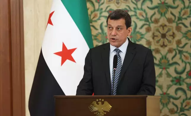 The commander of the Kurdish-led Syrian Democratic Forces Mazloum Abdi speaks during a news conference at the presidential palace in Damascus, Tuesday, Aug. 25, 2026. (AP Photo/Ghaith Alsayed)