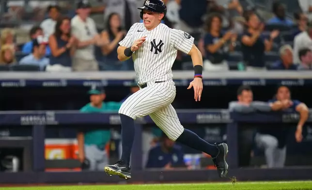 New York Yankees' Ben Rice runs to home plate to score on a double by Spencer Jones during the third inning of a baseball game against the Seattle MarinersWednesday, Aug. 12, 2026, in New York. (AP Photo/Frank Franklin II)