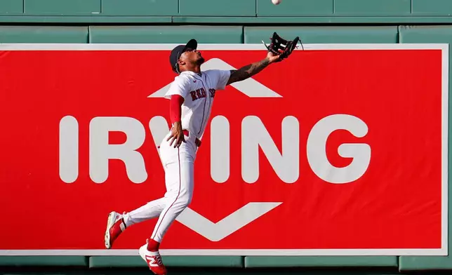 Boston Red Sox center fielder Ceddanne Rafaela reaches for a catch during the sixth inning of a baseball game against the Arizona Diamondbacks Wednesday, Aug. 19, 2026, in Boston. (AP Photo/CJ Gunther)