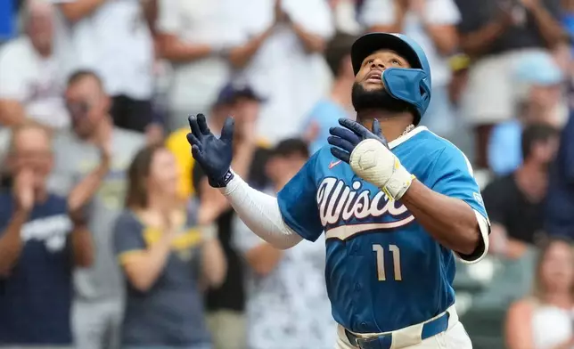 Milwaukee Brewers' Jackson Chourio gestures as he rounds the bases after hitting a solo home run during the first inning of a baseball game against the Minnesota Twins, Friday, Aug. 7, 2026, in Milwaukee. (AP Photo/Aaron Gash)