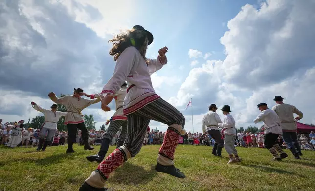 Estonia Seto Kingdom Day Men wearing traditional Seto costumes dance during the annual Seto Kingdom Day in Mikitamäe, south Estonia, Saturday, Aug. 1, 2026. (AP Photo/Sergei Grits)