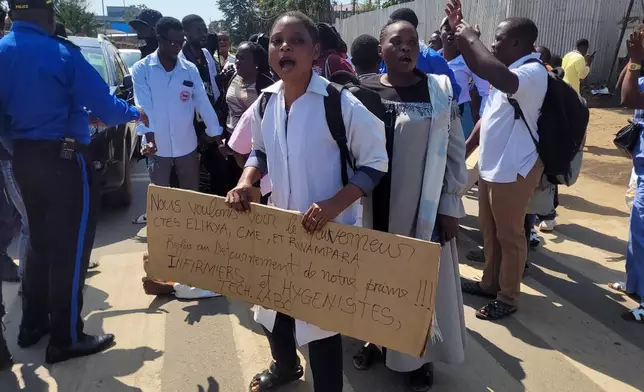Health workers at the epicenter of Ebola outbreak protest over unpaid wages at the provincial governor's office in Ituri, eastern Congo, Thursday, Aug. 6, 2026. (AP Photo/Constant Same Bagalwa)