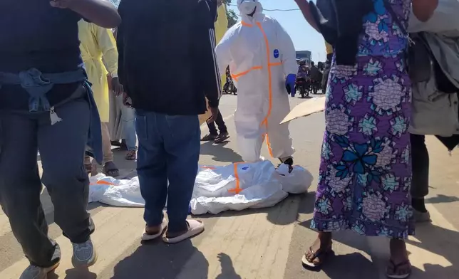 Health workers at the epicenter of Ebola outbreak protest over unpaid wages at the provincial governor's office in Ituri, eastern Congo, Thursday, Aug. 6, 2026. (AP Photo/Constant Same Bagalwa)
