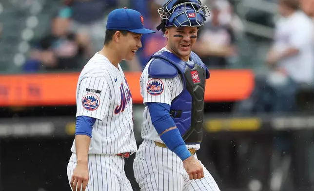 New York Mets pitcher Kodai Senga and catcher Luis Torrens smile after a win over the Washington Nationals in the ninth inning of a baseball game, Sunday, Aug. 16, 2026, in New York. (AP Photo/Heather Khalifa)