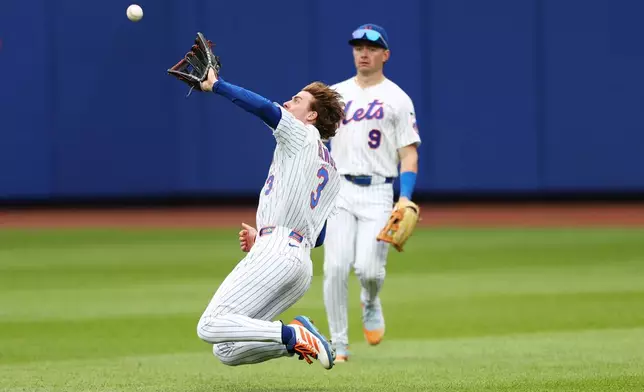 New York Mets right fielder Carson Benge (3) catches a fly ball hit by Washington Nationals' Daylen Lile during the sixth inning of a baseball game, Sunday, Aug. 16, 2026, in New York. (AP Photo/Heather Khalifa)