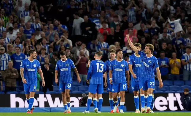 Brighton and Hove Albion's Mats Wieffer, right, celebrates scoring during the Conference League play-off second leg soccer match between Brighton and Hove Albion and Tromso in Brighton, England, Thursday Aug. 27, 2026. (Gareth Fuller/PA via AP)
