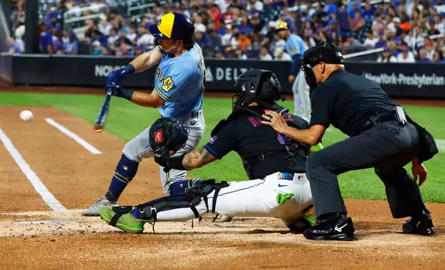 Milwaukee Brewers' Sal Frelick hits a RBI single during the second inning of a baseball game against the New York Mets, Wednesday, Aug. 26, 2026, in New York. (AP Photo/Noah K. Murray)