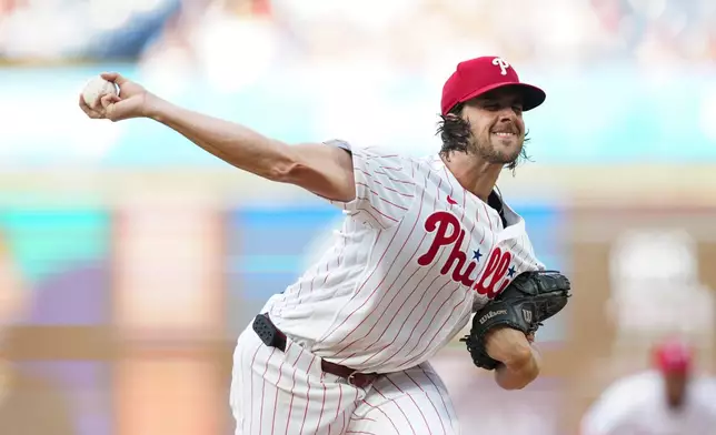Philadelphia Phillies pitcher Aaron Nola throws during the first inning of a baseball game against the Miami Marlins, Wednesday, Aug. 19, 2026, in Philadelphia. (AP Photo/Derik Hamilton)