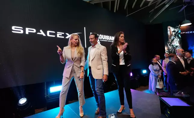 SpaceX President and COO Gwynne Shotwell, left, speaks with Louisiana Gov. Jeff Landry, center, and Sec. of Louisiana Economic Development Susan Bonnett Bourgeois during an event with SpaceX announcing a deal to build a new spaceport in Louisiana, Tuesday, Aug. 25, 2026, in Abbeville, La. (AP Photo/Gerald Herbert)