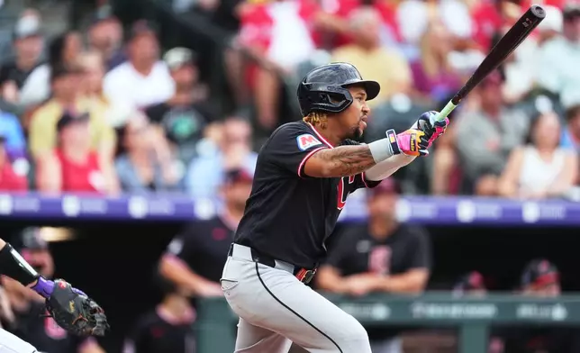 Cleveland Guardians' José Ramírez flies out against Colorado Rockies starting pitcher Gabriel Hughes in the first inning of a baseball game Saturday, Aug. 22, 2026, in Denver. (AP Photo/David Zalubowski)