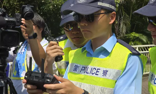 Operators remotely control the drones. Photo by Bastille Post