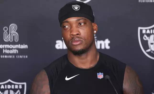 Las Vegas Raiders linebacker Quay Walker (7) speaks during a news conference at the team's NFL football training camp, Thursday, July 30, 2026, in Henderson, Nev. (AP Photo/Ian Maule)