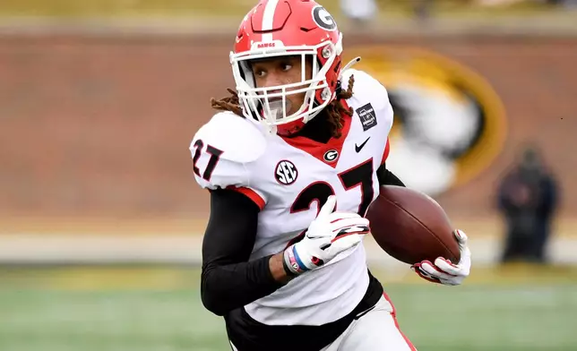 FILE - Georgia defensive back Eric Stokes runs with the ball after intercepting a pass during the first half of an NCAA college football game against Missouri, Dec. 12, 2020, in Columbia, Mo. (AP Photo/L.G. Patterson, File)