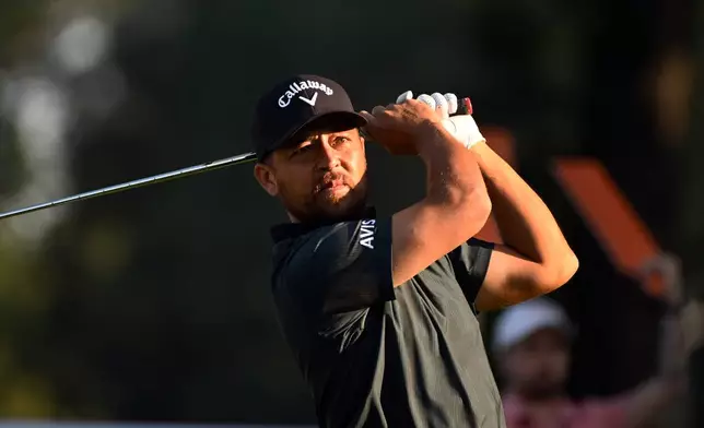 Xander Schauffele hits from the 11th tee during the first round of the Rocket Classic golf tournament at the Detroit Golf Club, Thursday, July 30, 2026, in Detroit. (AP Photo/Jose Juarez)