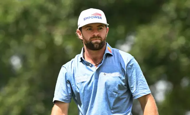 Cameron Young watches his shot from the ninth tee during the first round of the Rocket Classic golf tournament at the Detroit Golf Club, Thursday, July 30, 2026, in Detroit. (AP Photo/Jose Juarez)