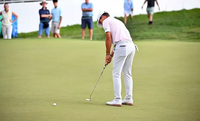 Michael Brennan putts on the 18th green during the first round of the Rocket Classic golf tournament at the Detroit Golf Club, Thursday, July 30, 2026, in Detroit. (AP Photo/Jose Juarez)