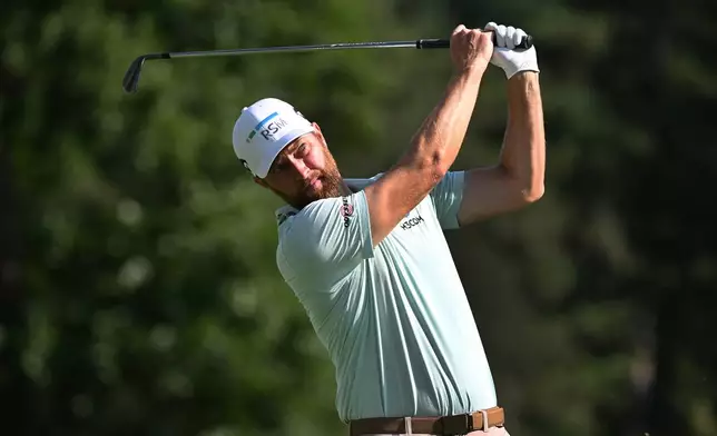 Chris Kirk hits from the ninth tee during the first round of the Rocket Classic golf tournament at the Detroit Golf Club, Thursday, July 30, 2026, in Detroit. (AP Photo/Jose Juarez)
