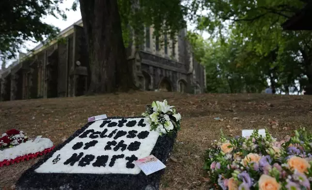 Flowers are decorated outside St. Mary's Church in Swansea, Wales, Monday, Aug. 17, 2026 for the funeral of Bonnie Tyler after The Total Eclipse Of The Heart musician, whose real name was Gaynor Hopkins, died in hospital in Portugal on July 8 at the age of 75. (AP Photo/Alastair Grant)