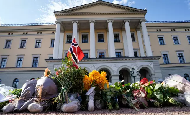 Flowers are left at Slottsplassen after officials said Norwegian King Harald V was in “very serious condition” as his health deteriorated, Thursday, Aug. 27, 2026, in Oslo. (Cornelius Poppe /NTB Scanpix via AP)