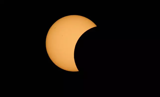 The moon moves in front of the sun during a total solar eclipse is seen from Berlanga de Duero, central Spain, Wednesday, Aug. 12, 2026. (AP Photo/Bernat Armangue)