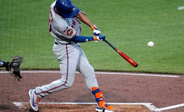 New York Mets' Marcus Semien hits a three-run home run off Pittsburgh Pirates pitcher Carmen Mlodzinski during the third inning of a baseball game in Pittsburgh, Friday, Aug. 7, 2026. (AP Photo/Gene J. Puskar)