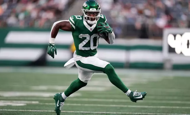 New York Jets running back Breece Hall runs up field during the first half of a preseason NFL football game against the Tampa Bay Buccaneers, Friday, Aug. 14, 2026, in East Rutherford, N.J. (AP Photo/Frank Franklin II)