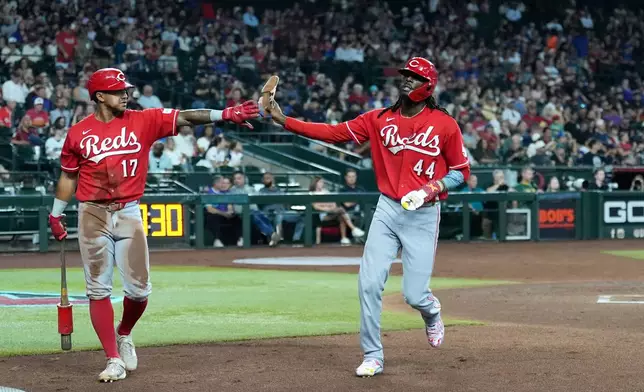 Cincinnati Reds' Elly De La Cruz (44) celebrates his run scored against the Arizona Diamondbacks with Reds' Dane Myers (17) during the third inning of a baseball game, Sunday, Aug. 23, 2026, in Phoenix. (AP Photo/Ross D. Franklin)