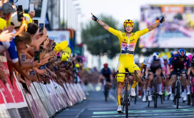 Netherlands' Lorena Wiebes of team SD Worx Protime celebrates crossing the finish line to win the second stage a 149 km from Aigle to Geneva during the Women's Tour de France (Tour de France Femmes), in Geneva, Switzerland, Sunday, Aug. 2, 2026. (Jean-Christophe Bott/Keystone via AP)