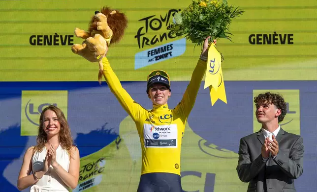 Netherlands' Lorena Wiebes of team SD Worx Protime celebrates on the podium with the yellow jersey after the second stage a 149 km from Aigle to Geneva during the Women's Tour de France (Tour de France Femmes), in Geneva, Switzerland, Sunday, Aug. 2, 2026. (Jean-Christophe Bott/Keystone via AP)
