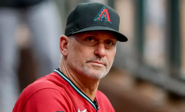 Arizona Diamondbacks manager Torey Lovullo in the dugout before the first pitch of a baseball game against the Atlanta Braves, Saturday, Aug. 15, 2026, in Atlanta. (AP Photo/Erik S. Lesser)