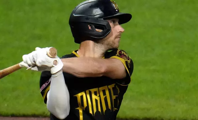 Pittsburgh Pirates' Brandon Lowe watches his three-home run off Boston Red Sox pitcher Jovani Morán during the fifth inning of a baseball game in Pittsburgh, Friday, Aug. 14, 2026. (AP Photo/Gene J. Puskar)