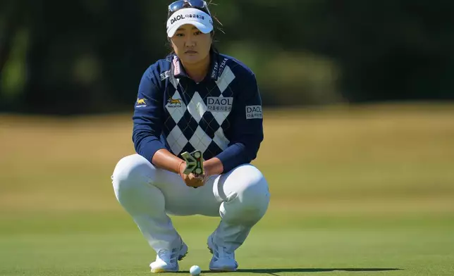 Haeran Ryu, of South Korea, lines up a putt on the 2nd green during the second round of the Women's British Open golf championship in Lytham St Annes, England, Friday, July 31, 2026. (AP Photo/Jon Super)