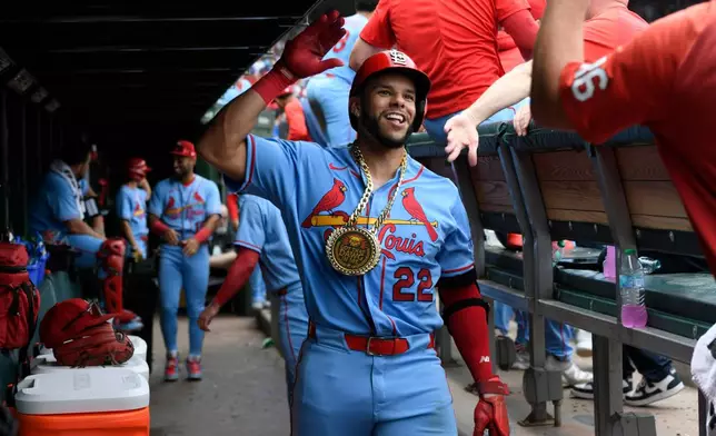St. Louis Cardinals' Joshua Baez (22) celebrates with teammates in the dugout after hitting a solo home run during the fourth inning of a baseball game against the Chicago Cubs in Chicago, Saturday, Aug. 15, 2026. (AP Photo/Paul Beaty)