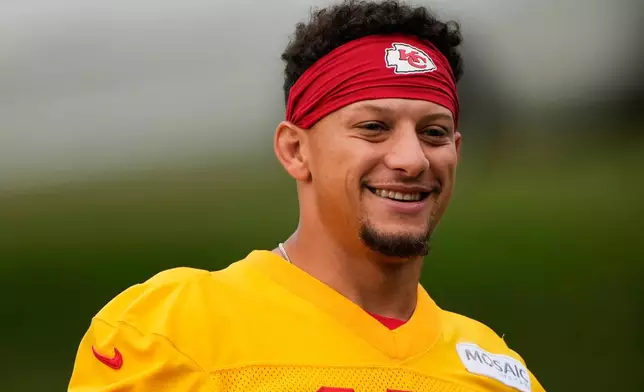 Kansas City Chiefs quarterback Patrick Mahomes (15) arrives at NFL football training camp Friday, July 31, 2026, in St. Joseph, Mo. (AP Photo/Charlie Riedel)