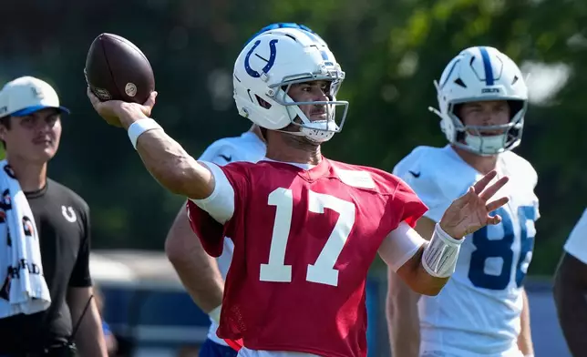 Indianapolis Colts quarterback Daniel Jones (17) throws during practice at the team's NFL football training camp in Westfield, Ind., Friday, July 31, 2026. (AP Photo/Michael Conroy)