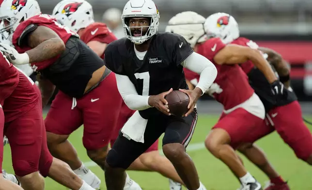Arizona Cardinals quarterback Jacoby Brissett (7) takes the snap during practice at the NFL football team's training camp, Wednesday, July 29, 2026, in Glendale, Ariz. (AP Photo/Ross D. Franklin)