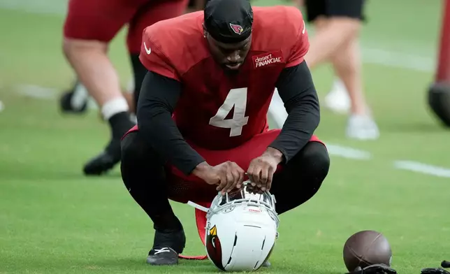 Arizona Cardinals running back Jeremiyah Love adjusts his helmet visor during NFL football training camp, Tuesday, July 28, 2026, in Glendale, Ariz. (AP Photo/Ross D. Franklin)