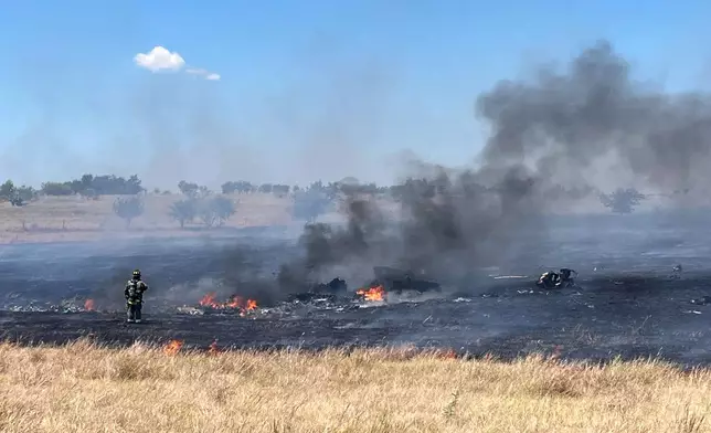 This photo provided by the Bell County Sheriff's Office shows the scene of an Army Apache helicopter crash Wednesday, Aug. 12, 2026, near Salado, Texas. (Cliff Coleman/Bell County Sherrif's Office via AP)